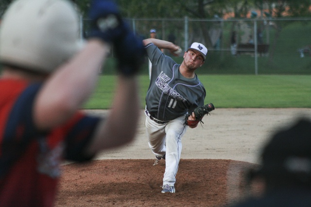 Lake Washington senior Paul Falco throws out a pitch during the Kangaroos’ 4-3 win over Juanita on Wednesday