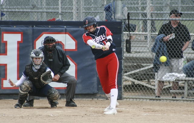 Juanita’s Lisa Nelson makes solid contact with a pitch during the Rebels’ 19-2 win over Bellevue on Wednesday
