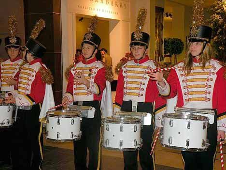 Drake Tyksinski (third from left) and Adam Holm (to his left) recently received an award for not missing a scheduled performance in the five years they have been drummers in Snow Flake Lane and Celebration Lane in Bellevue. Both drummers live in Kirkland.