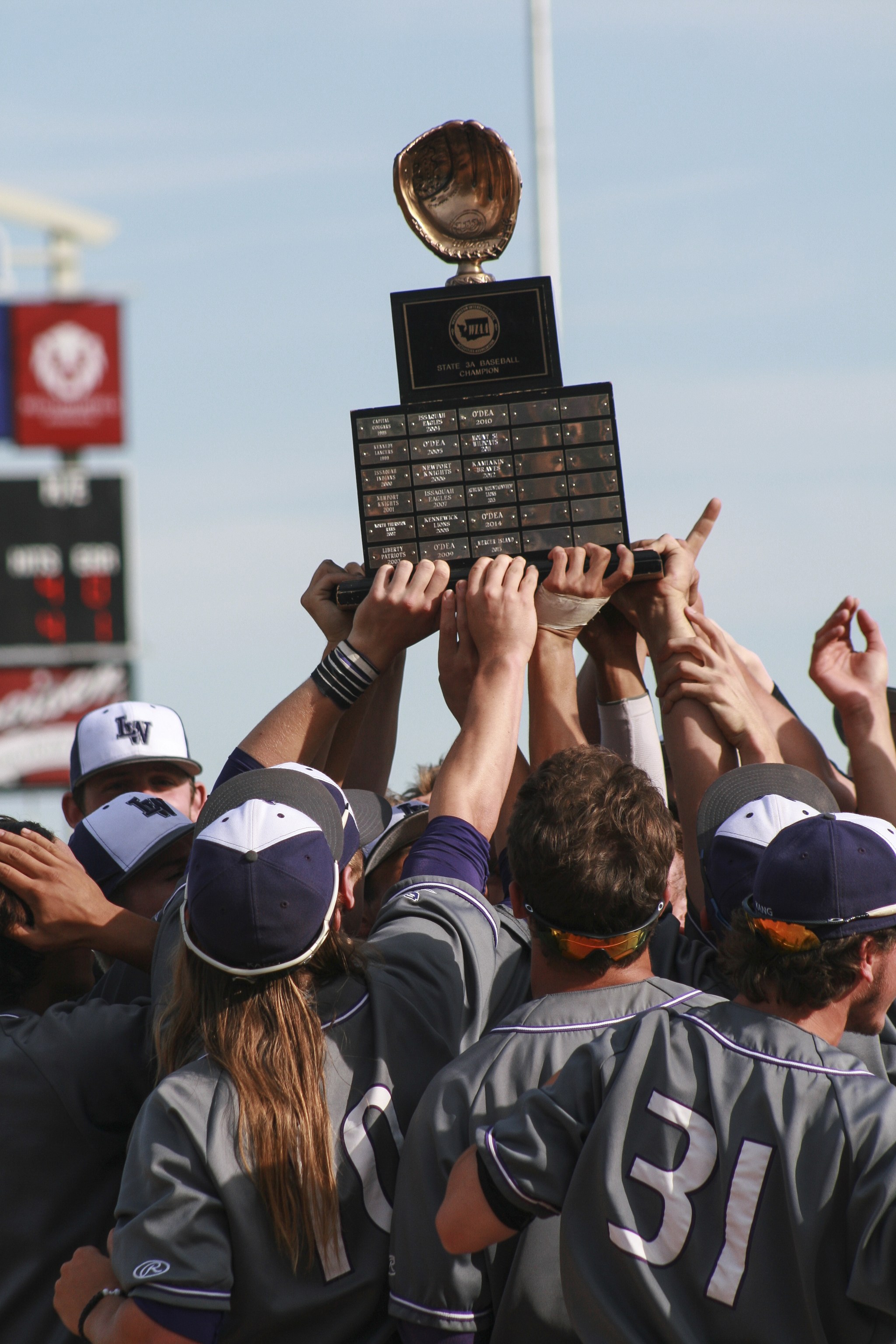 The Lake Washington High baseball team hoists the state title trophy following a 2-0 win over Lakeside on May 28 at Gesa Stadium in Pasco. JOHN WILLIAM HOWARD/Kirkland Reporter