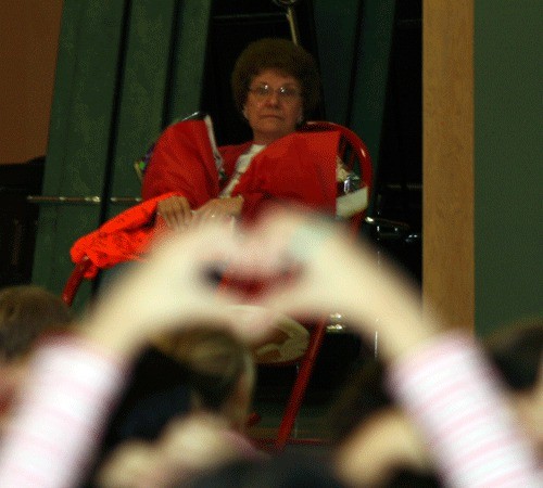 Janice Yuly enjoys a singing of Seasons of Love from Rose Hill Elementary students for her retirement.