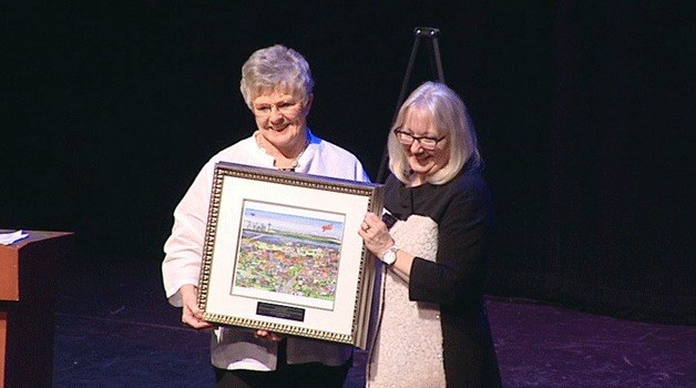 Sue Contreras accepted a CACHET Award from Major Joan McBride in 2013 for her efforts in fundraising for the restoration of the Capt. Anderson Ferry Clock and for her volunteer support of Summerfest.