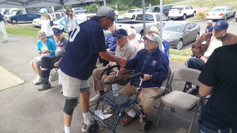 Aegis Living community members enjoy a tailgate party in Kirkland along with a softball game. Contributed photo