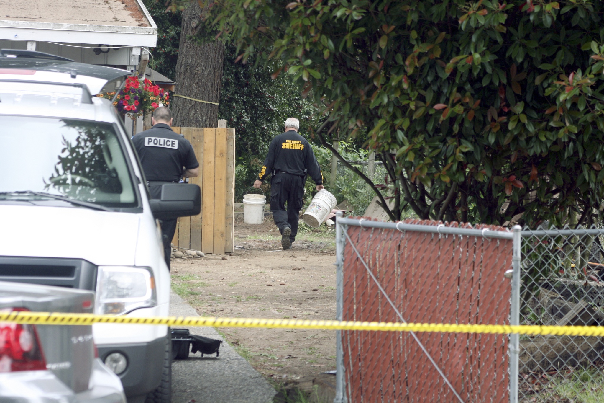 King County Sheriff's deputies search the back yard of a home on the Kenmore and Kirkland boundary for clue to the whereabouts of Jammie Haggard