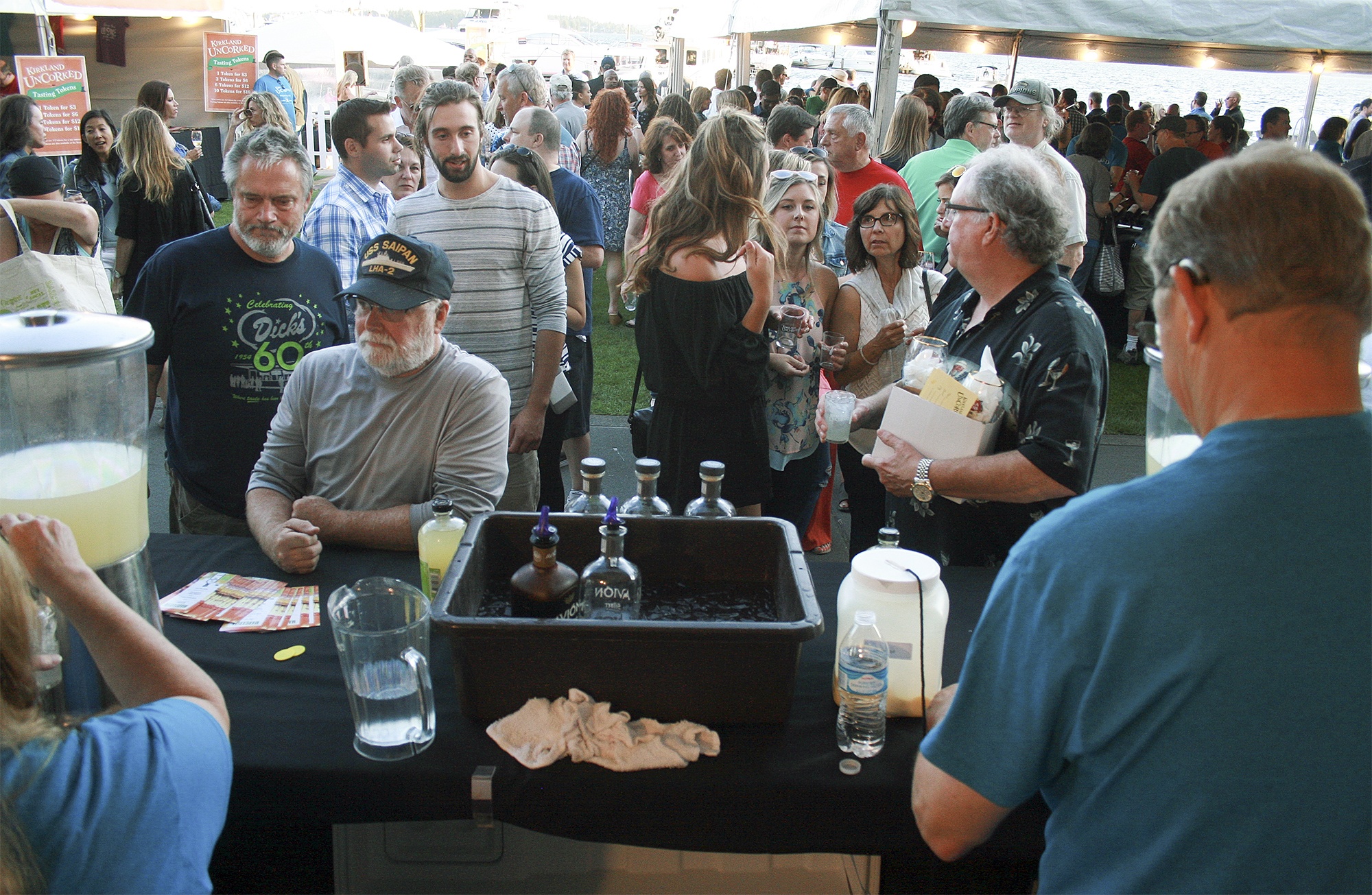 Festival-goers stand in line for margaritas on July 15 at Marina Park in Kirkland. The annual wine and beer festival packed the park on Friday