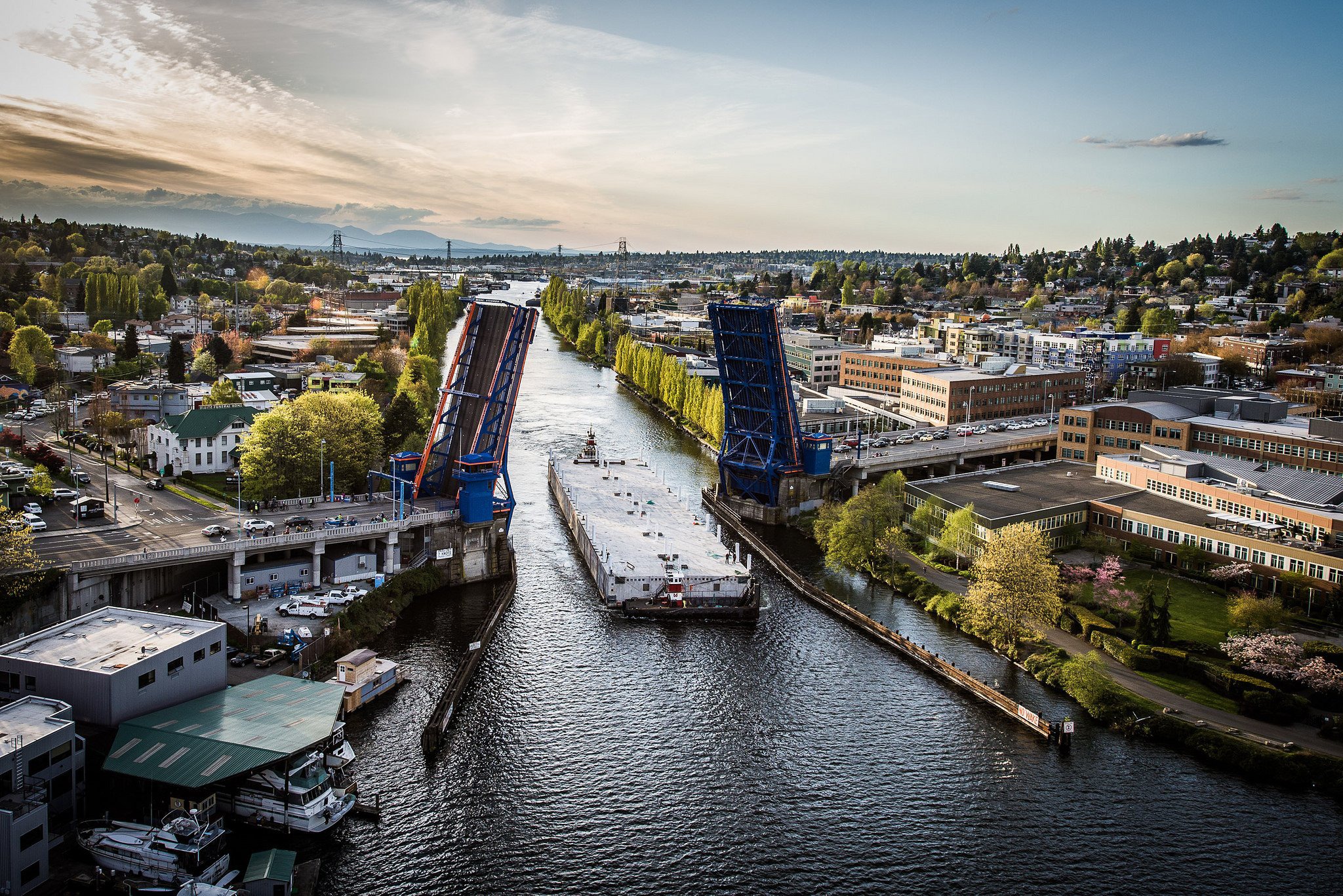A pontoon from the old SR 520 bridge passes the Freemont Bridge in Seattle. Photo courtesy of WSDOT.