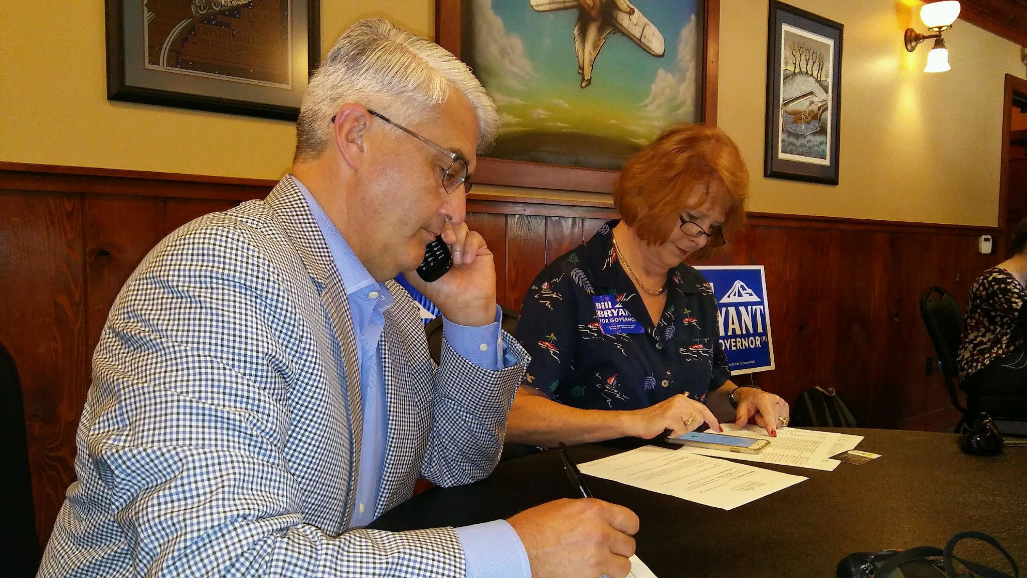 Bill Bryant makes campaign phone calls along with a volunteer. Aaron Kunkler/Bothell Reporter