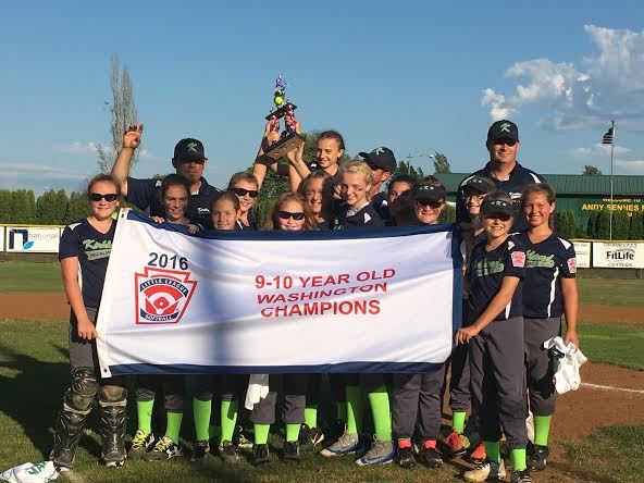 The Kirkland 9/10 All-Star softball team clutches the state championship banner after defeating Camas on Thursday in Chehalis. Courtesy photo.
