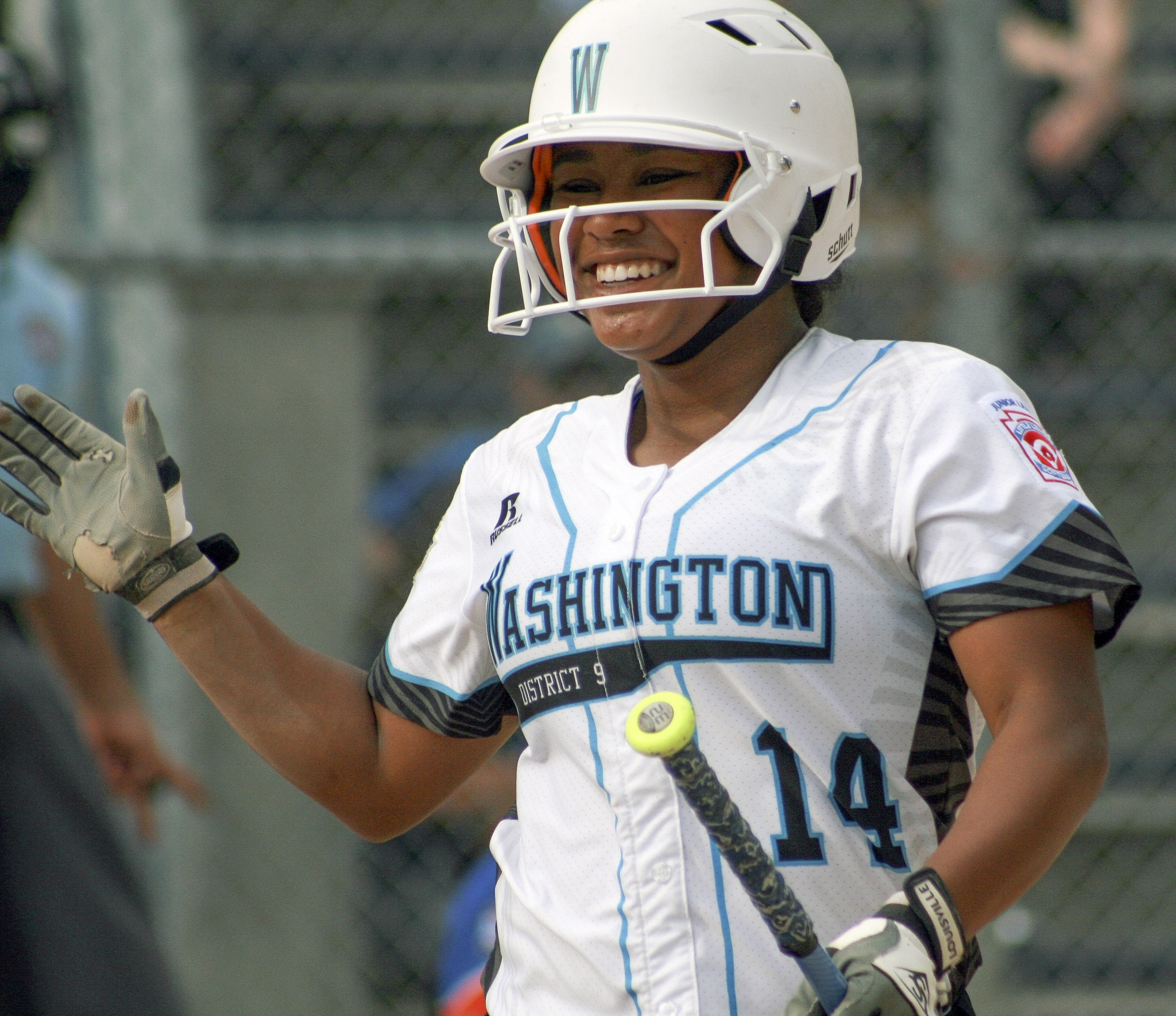 Sasha Mitchell greets teammates after scoring a run early in Tuesday’s game against a team from Poland