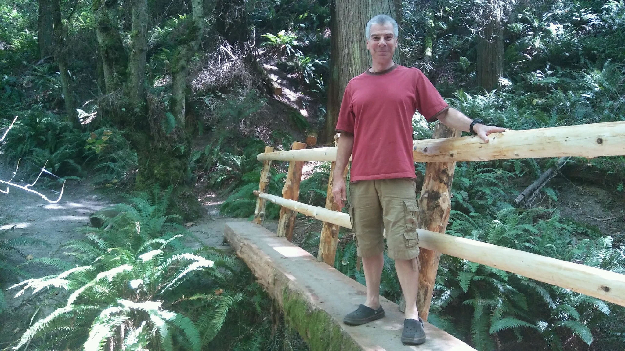 Neil Ostroff stands on one of the newly constructed bridges at Big Finn Hill Park. AARON KUNKLER/Kirkland Reporter