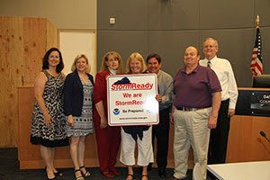 Kirkland City Councilmembers and city staff receive the StormReady designation from the Warning Coordination Meteorologist for the Seattle/Tacoma National Weather Service. Contributed photo