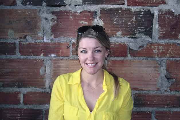 Lady Yum owner Megan Gordon stands in front of her new store’s brick wall. Gordon and her partner Shan S. Foisy hope to open in mid-June.