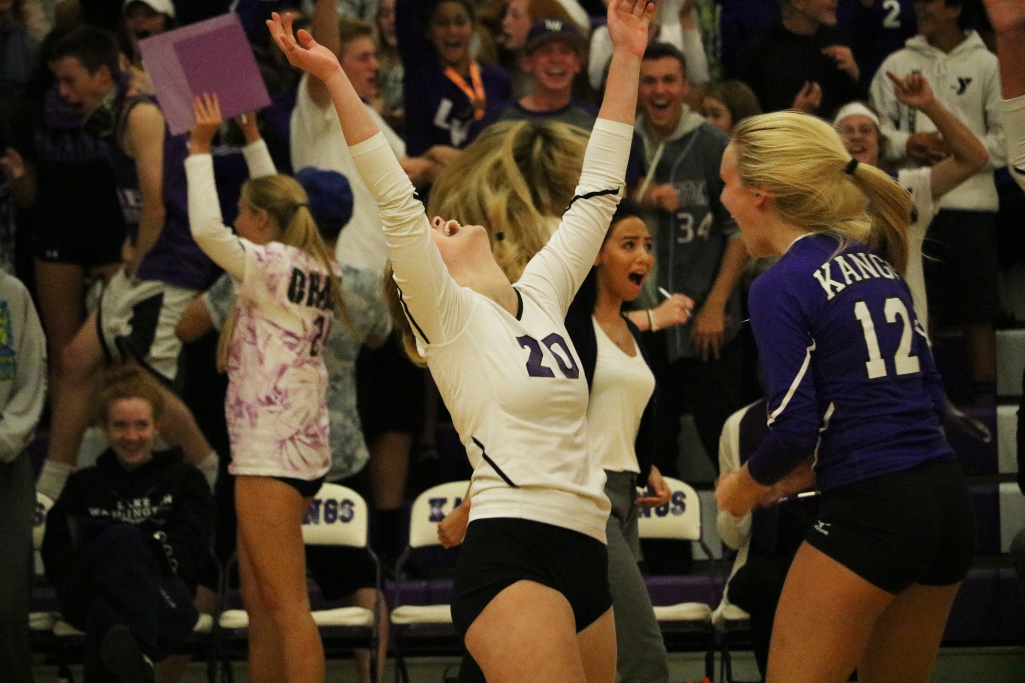 Lake Washington junior Isabel Day (20) celebrates with teammate Skylar Brown after scoring a point midway through the fifth set of Wednesday’s 3-2 win over Juanita. JOHN WILLIAM HOWARD/Kirkland Reporter