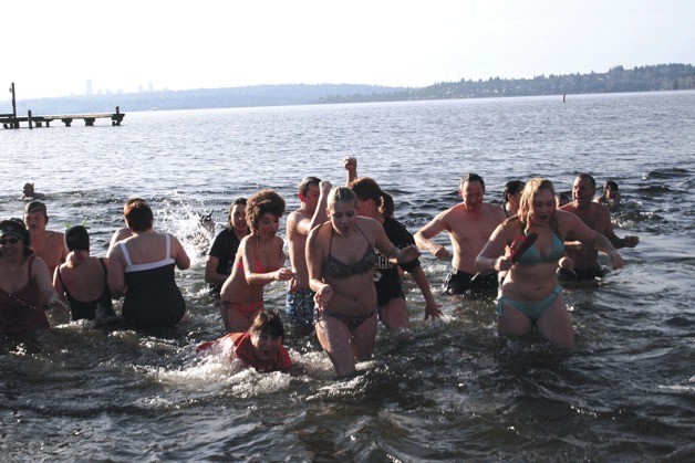 Hundreds of community members bravely took a dip in Lake Washington during the annual Kirkland Polar Bear Plunge last year. New Year's Day will mark the 12th year of the tradition.