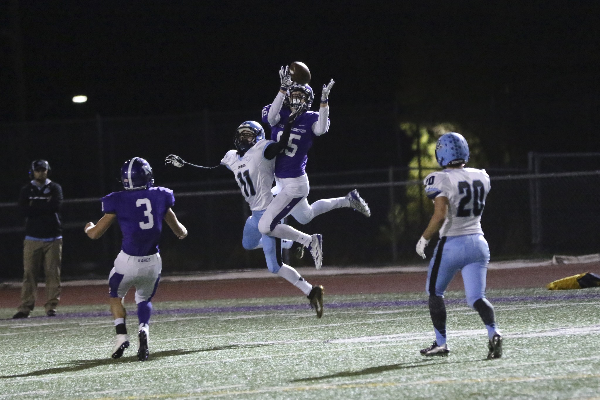 Lake Washington receiver Domonic Roussell (85) out-jumps Interlake’s Michael Veliyev (11) during Friday’s game at Mac Field. Photo courtesy of Willy Paine.