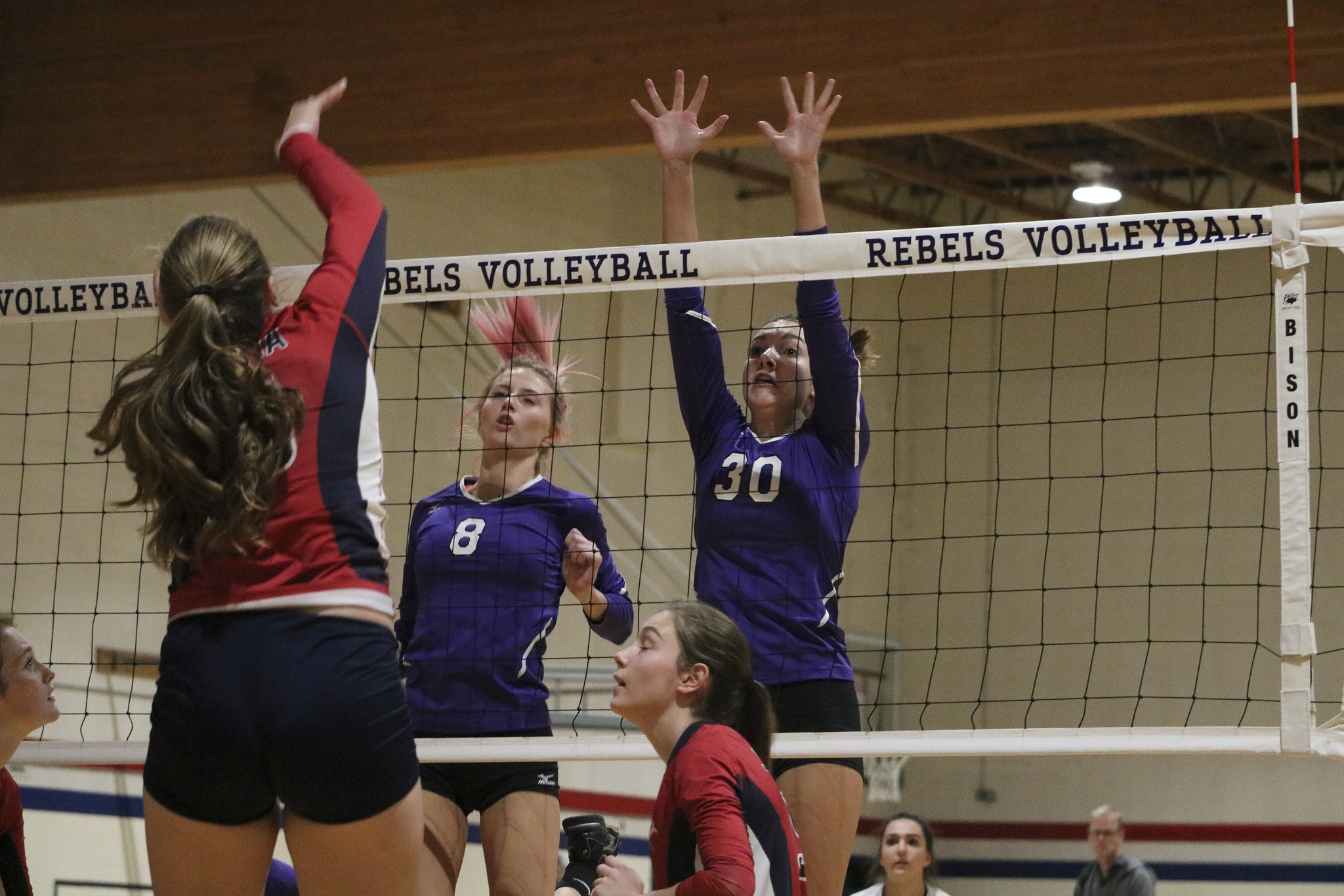 Lake Washington senior Baylee Eaton-Hill (8) and junior Haley Kubik (30) rise for a block during the Kangs’ 3-0 win over Juanita on Monday evening. JOHN WILLIAM HOWARD/Kirkland Reporter