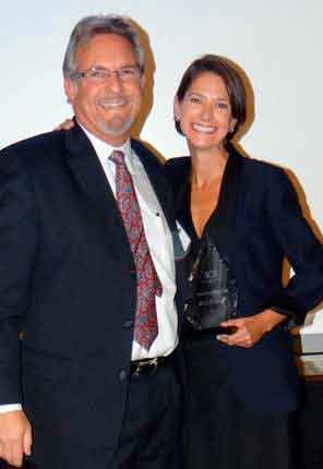 Former Kirkland City Council member Bob Sternoff receives the Member Emeritus Award from Sound City Association Executive Director Deanna Dawson.