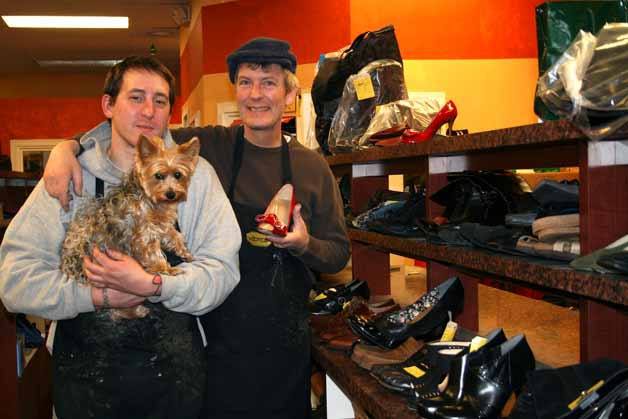 Randy Bailey (right) in the back of his business at Bailey's Shoe Repair