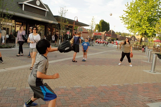 The city of Kirkland did away with the curbs on Park Lane in favor of a wide open brick road.