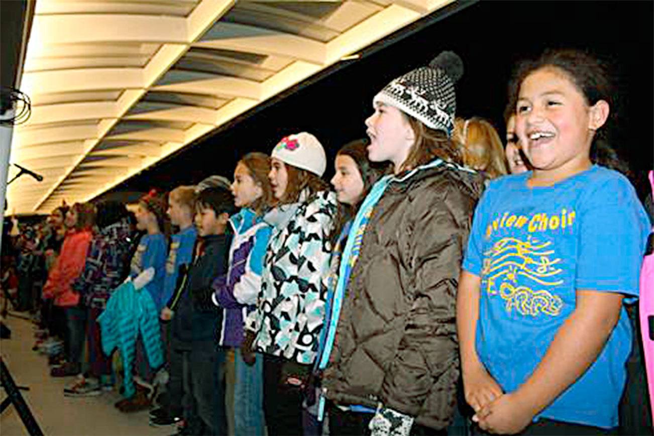 Local kids participate in holiday caroling as part of the 2015 celebration on the Google campus on the Cross Kirkland Corridor. Reporter file photo