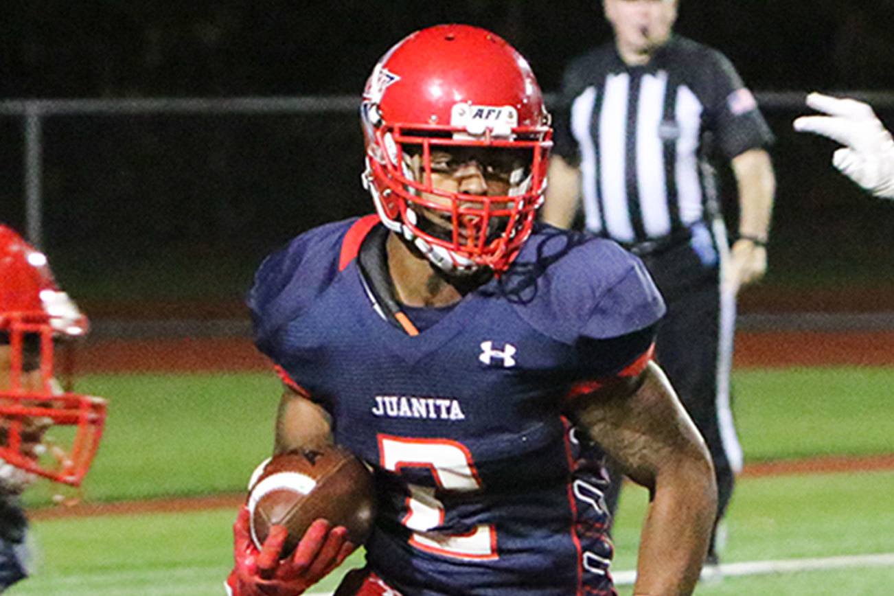 Juanita’s Salvon Ahmed outruns a Mercer Island defender earlier this season. Ahmed rushed for 13 touchdowns and more than 1,200 yards, earning the 3A KingCo offensive MVP award. JOE BYRNE/Courtesy photo