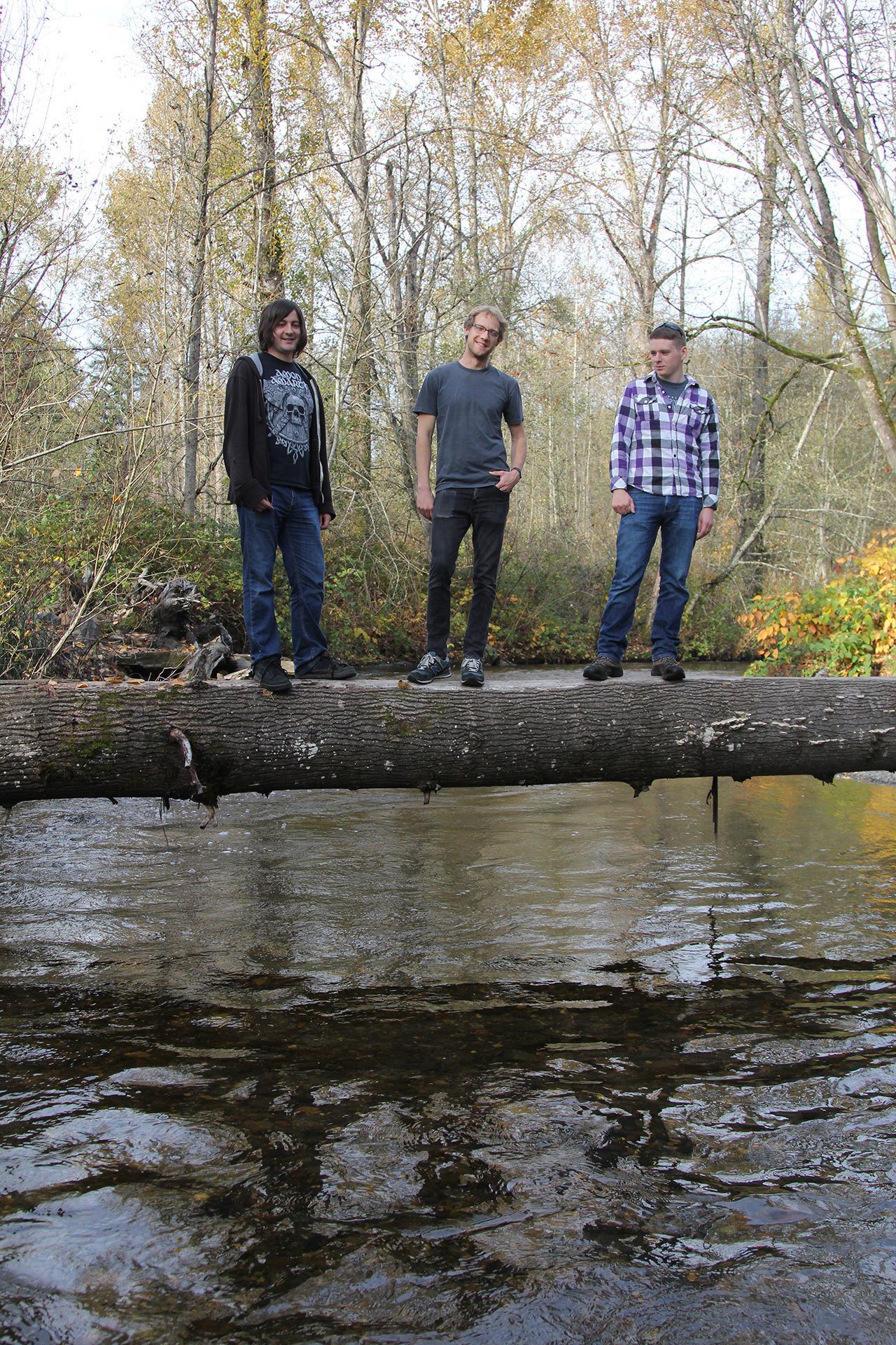 University of Washington Bothell biology majors (left to right) Jake Loew, Scott Miller and James Solberg survey Swamp Creek for any signs of Kokanee and to gather information for a restoration report. CELESTE GRACEY/Special to the Reporter