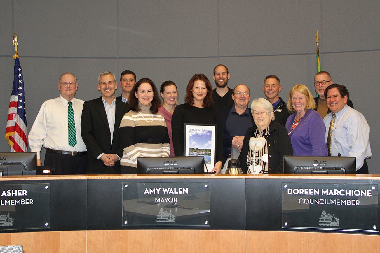 The Puget Sound Regional Council Vision 2040 Award is presented at the Nov. 1 Kirkland City Council meeting. Posing with the award are Kirkland City Councilmember Toby Nixon (from left), PSRC Executive Director Josh Brown, Google Real Estate Project Executive Mike Nolan, Councilmember Shelley Kloba, Google Head of External Affairs and Government Relations Darcy Nothnagle, Kirkland Mayor Amy Walen, DLR architect Mike Vander Ploeg, Councilmember Dave Asher, Councilmember Doreen Marchione, SRM Development Manager Dave Tomson, Councilmember Penny Sweet, Lake Washington School District Director of Support Services Forrest Miller and Deputy Mayor Jay Arnold. KATHY CUMMINGS/Contributed photo