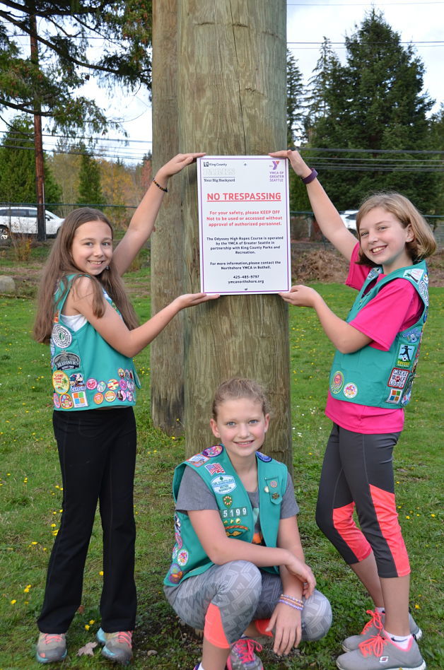 From left, Breanna Condron, Madison Binek and Fiona Welsford recently earned their Bronze Award by making improvements to the signage at the Cottage Lake YMCA Odyssey Ropes course in Woodinville.