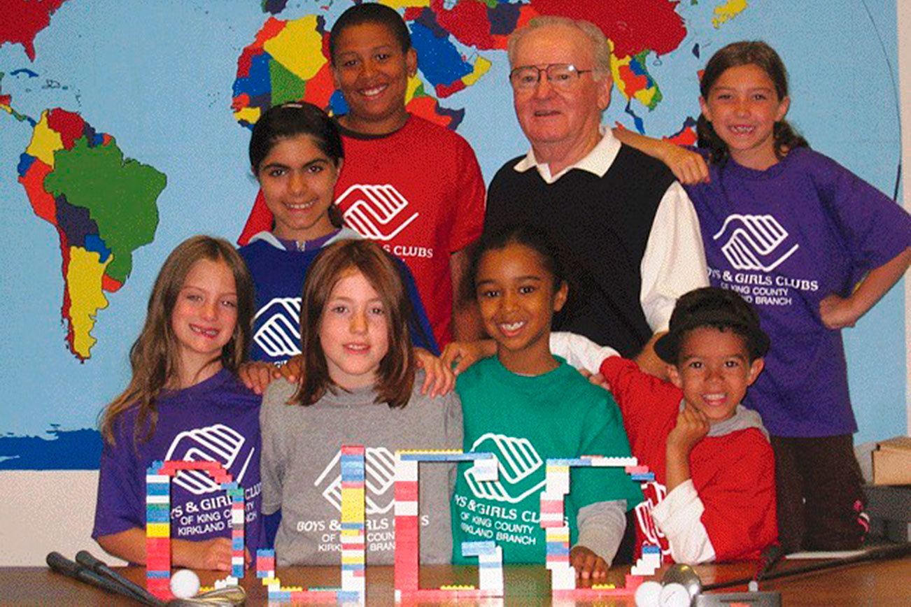 Legendary University of Washington football head coach and former Kirkland resident Don James with kids from the Kirkland Boys and Girls Club in a photo to promote the Don James Golf Classic charity event. Reporter file photo