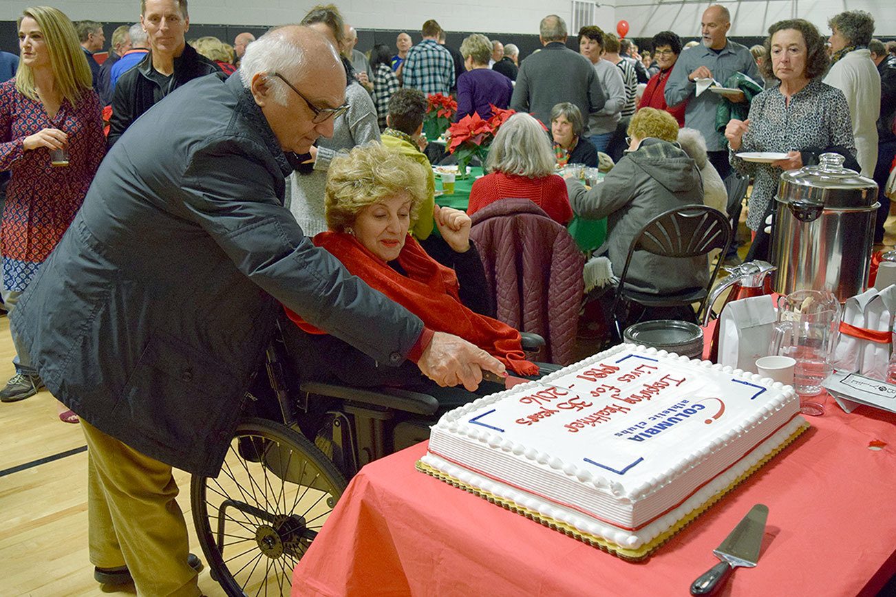 Columbia Athletic Club owners Cy and Feryal Oskoui cut the 35th anniversary cake. Julianna Jade/Contributed photo
