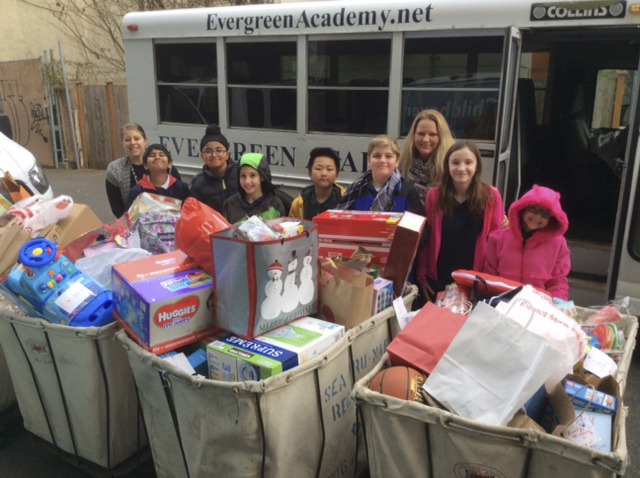 Evergreen Academy students pose with some of the items donated to Childhaven. Contributed photo