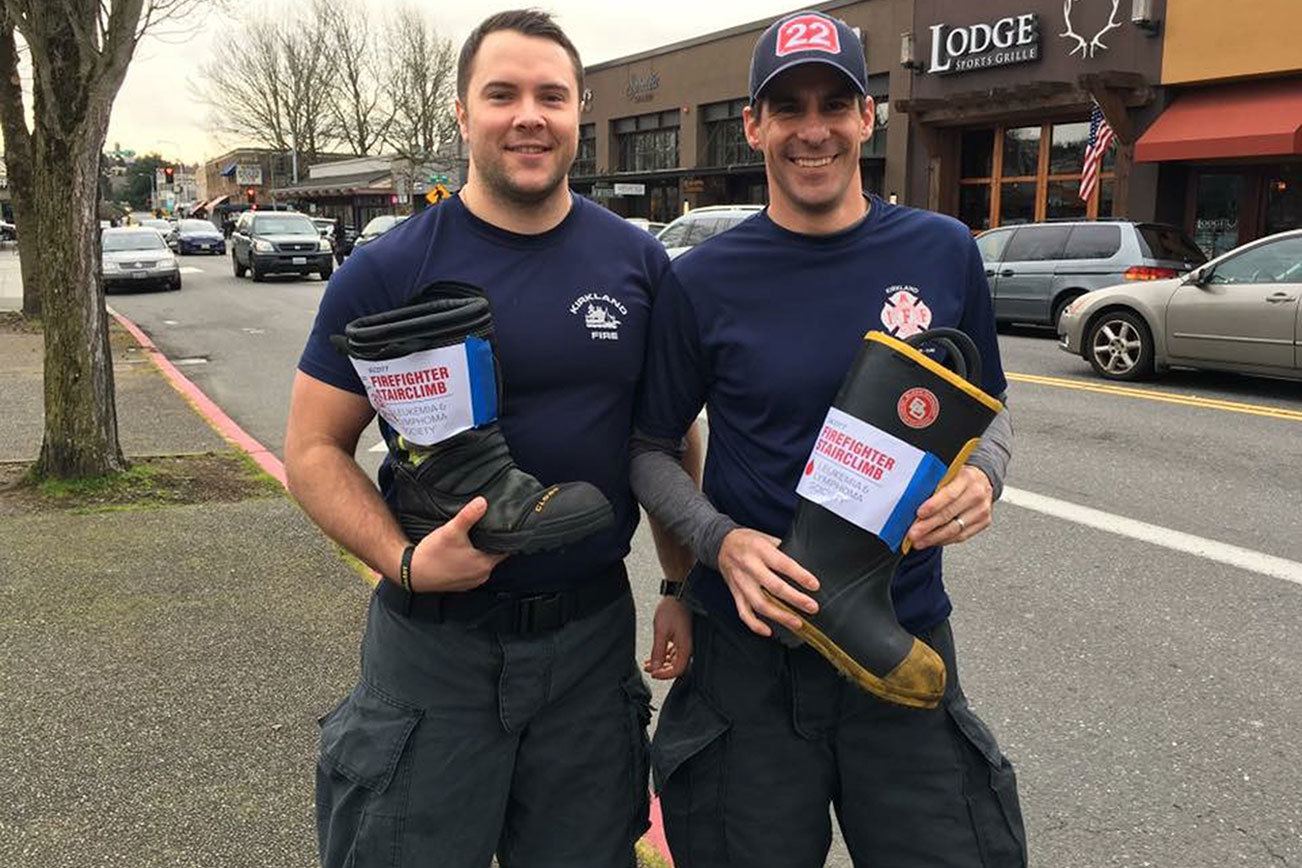 Kirkland firefighters, including from left, Eric Forslin and Jon Hernandez, collected more than $5,000 in their fundraising efforts on Jan. 28 thanks to community donations. Contributed photo