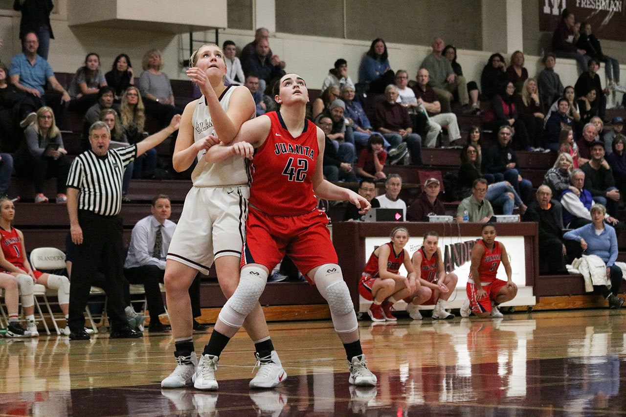 Mercer Island’s Anna Luce, left, and Juanita sophomore Alexis Intong fight for positioning in the fourth quarter of Mercer Island’s win on Feb. 4 in the conference semifinals. Luce led all scorers with 29 points. JOHN WILLIAM HOWARD/Kirkland Reporter