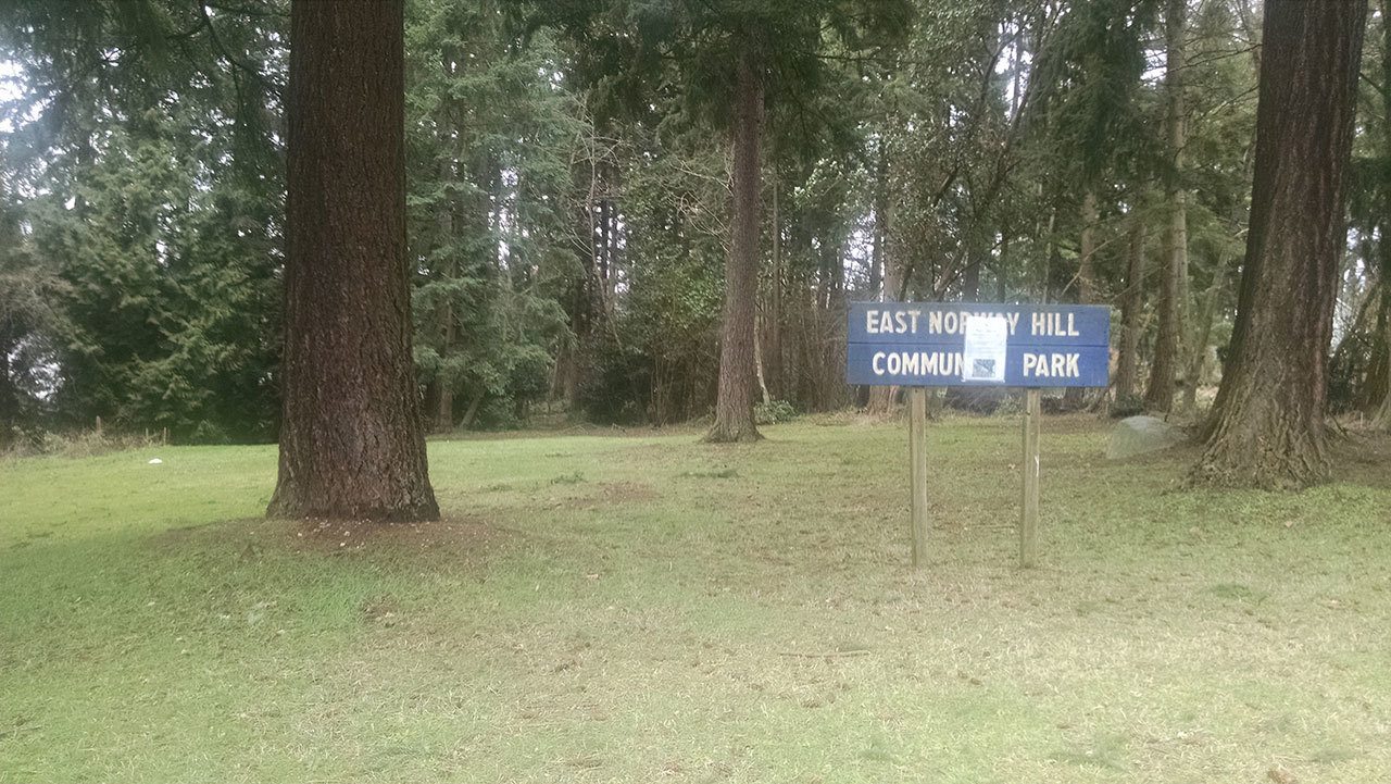 This open space near the Bothell-Kirkland border has been renamed Bud Homan Park. A document indicating the intent to do so is posted on top of the East Norway Hill Community Park sign. CATHERINE KRUMMEY / Kirkland Reporter