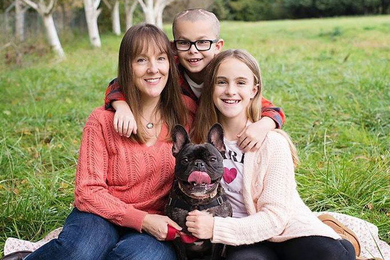 Mason Gordon poses for a photo alongside his mom, Lindsey; his sister, Greta; and their dog, Joey. Contributed photo