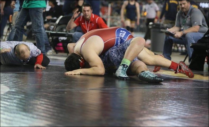 Juanita High junior wrestler John Nascimento pinned Southridge’s Yuriy Slutskiy in the Class 3A 285-pound quarterfinals on Feb. 17. Nascimento captured fifth place in the Class 3A 285-pound division after losing in the semifinals. DON BORIN/Courtesy photo