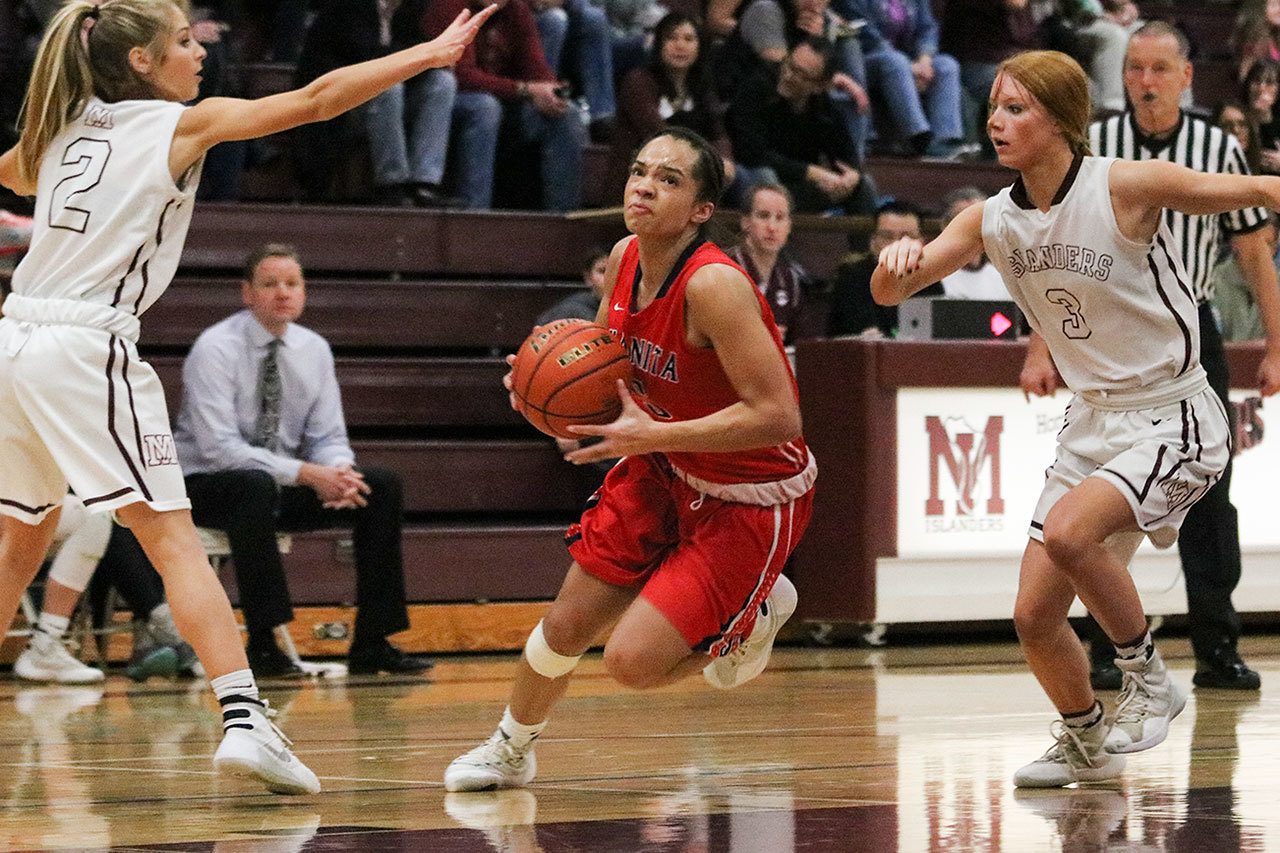Juanita senior Tea Adams drives to the basket during the Rebels’ loss to the Islanders on Feb. 4 on Mercer Island. Adams was named to the all-KingCo first-team. JOHN WILLIAM HOWARD/Kirkland Reporter