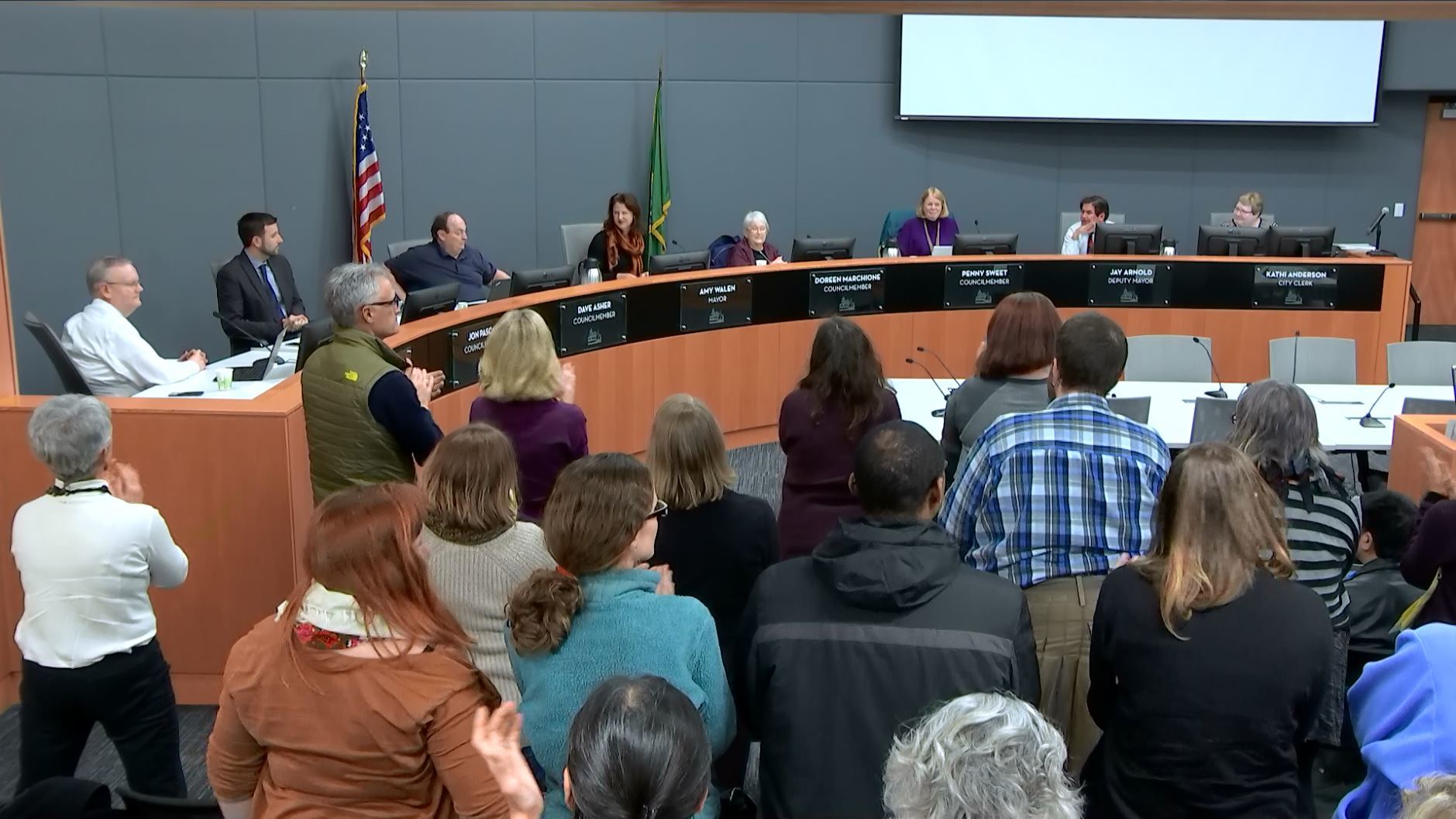 A crowd gathered at Kirkland City Hall gives a standing ovation to the Kirkland City Council for approving an ordinance and a resolution aimed at affirming the city as a safe, inclusive and welcoming place for all people. Contributed photo