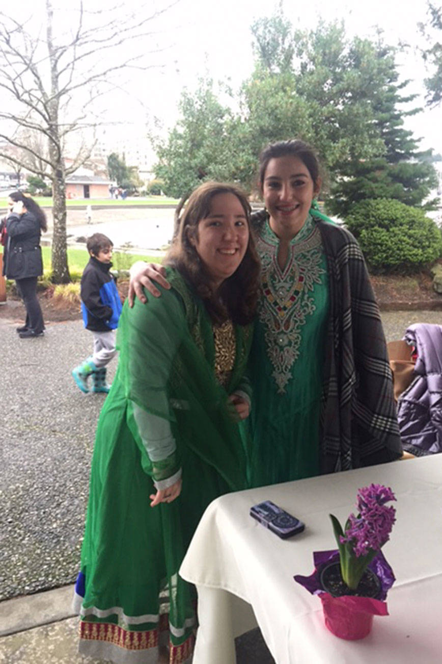 Parisa Baldwin and Ava Afshari pose for a photo at their face-painting station at the Nowruz Festival on March 18 at Marina Park in Kirkland. Contributed photo