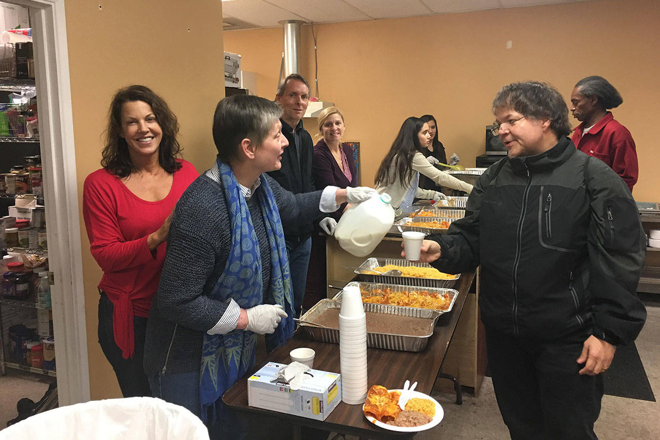 From left, Gina Casanova, Cordula Brown, Kevin Rolfes, Cindy Randazzo, and Sarah and Veronica Pangallo serve food at the Men’s Shelter. Contributed photo