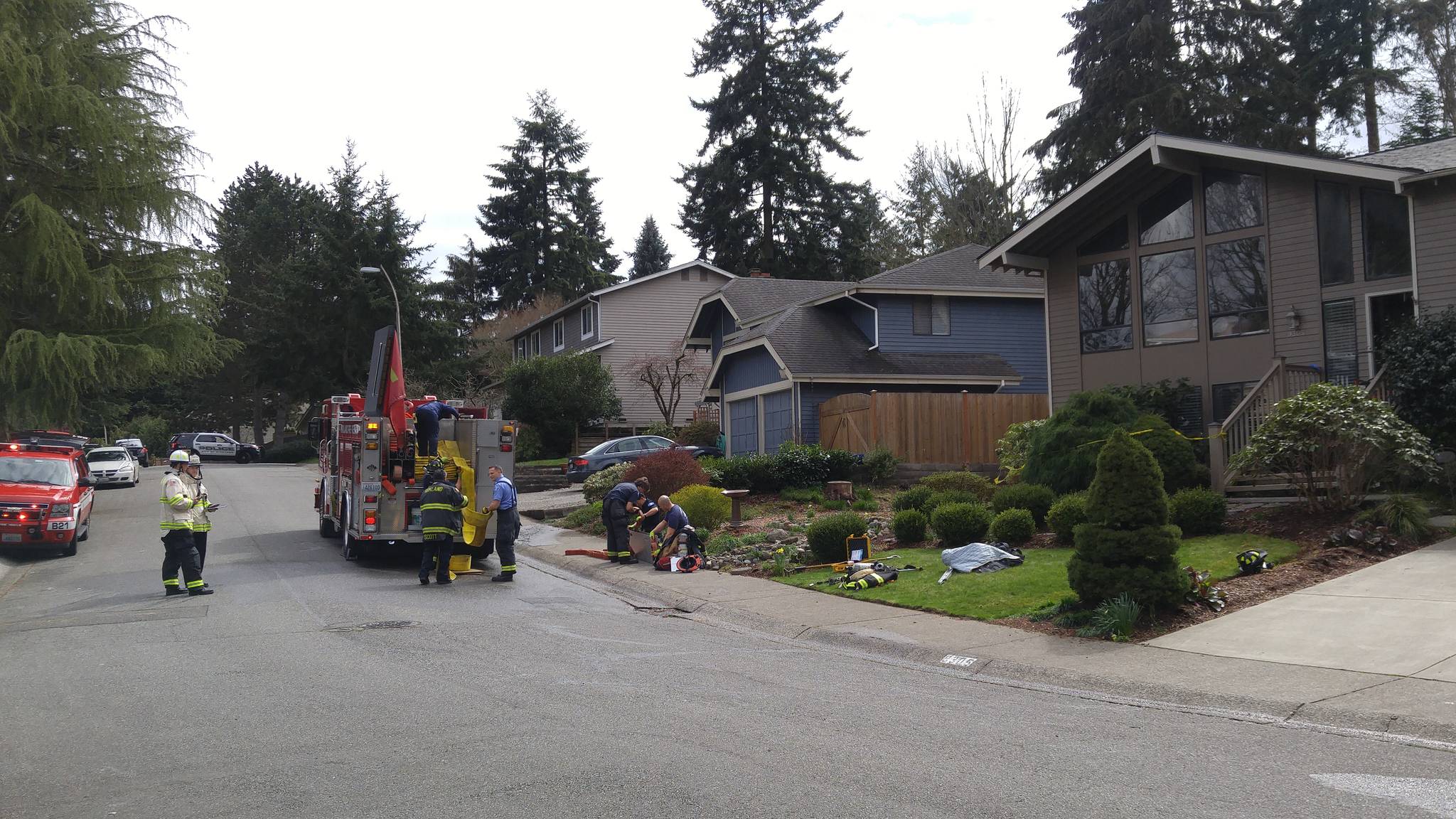Kirkland firefighters rescued a woman from the house on the far right after a fire broke out in the kitchen on Thursday. MATT PHELPS/Kirkland Reporter