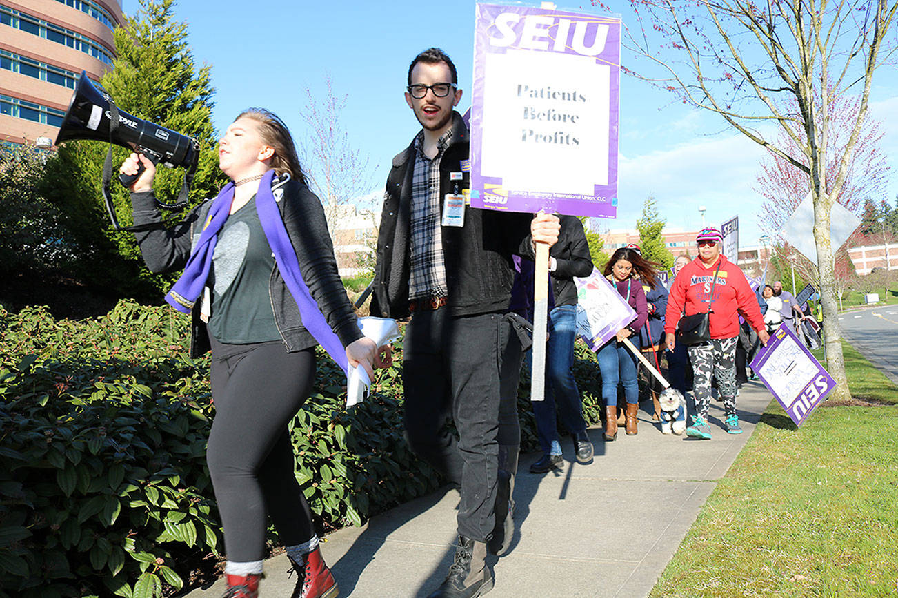 EvergreenHealth employees rally in Kirkland for higher wages, better healthcare