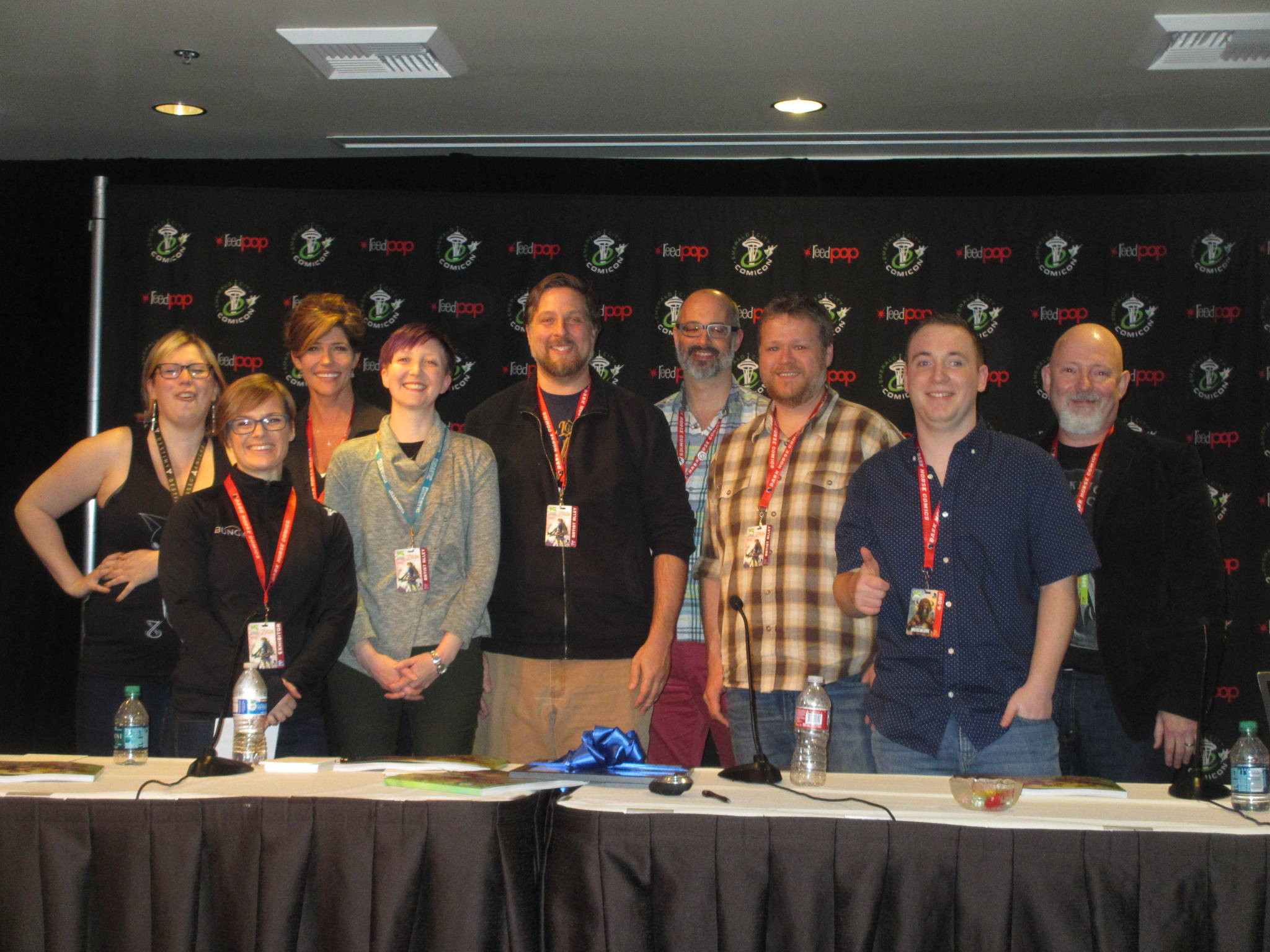 Kirkland resident Noah Ingram (second from right) poses from a photo alongside “Time Wreckers” contributors Zoe Brookes, Christine Edwards, Donna Verretto, Emily Figenschuch, Brett Bean, Chris Sheridan, Ethan Nicolle and Michael Jones on March 4 at Emerald City Comicon. Contributed photo