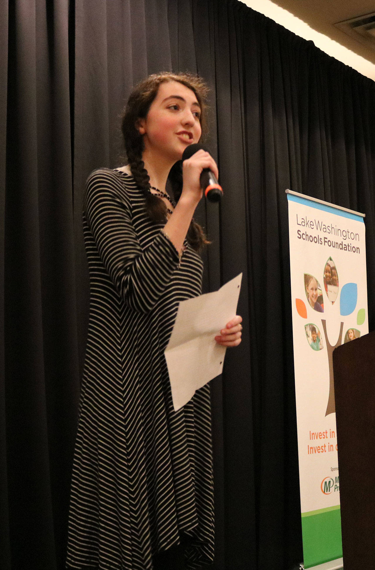 Juanita High School student and event emcee Grace Harrington addresses the crowd at the Lake Washington Schools Foundation luncheon on Tuesday. Samantha Pak, Redmond Reporter