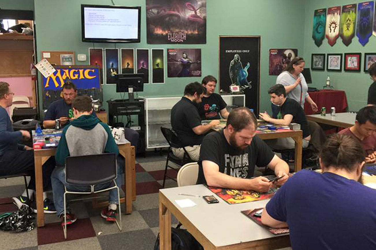 Patrons participate in an event at Games and Gizmos’ previous location in Redmond. The store relocated to Kirkland in September. Contributed photo