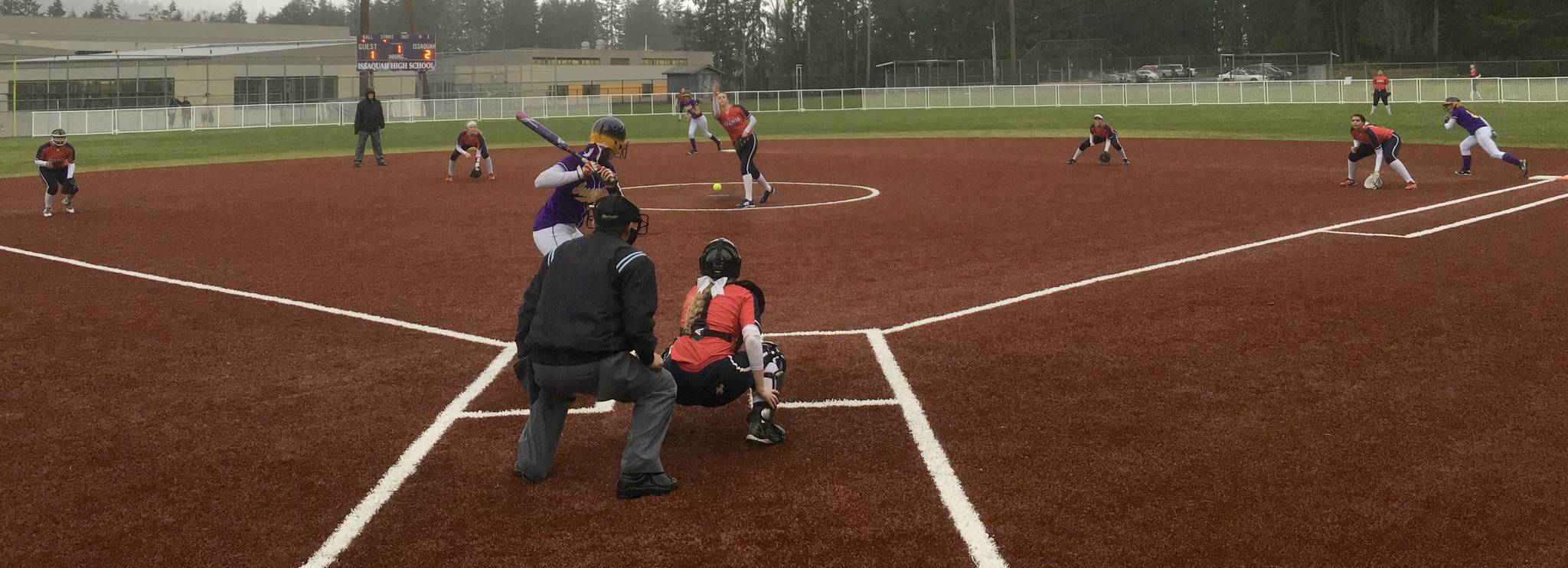 Juanita’s Megan Murray unleashes a pitch while her fielders prepare for action during a recent game. Shannon Longcore photo