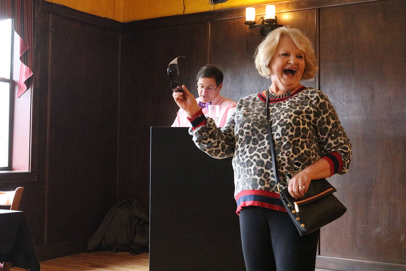 Eunice Hostetter models fashions from Essentials on Park Lane during an American Cancer Society fashion show at Wilde Rover emceed by J.D. Drollinger. CATHERINE KRUMMEY/Kirkland Reporter