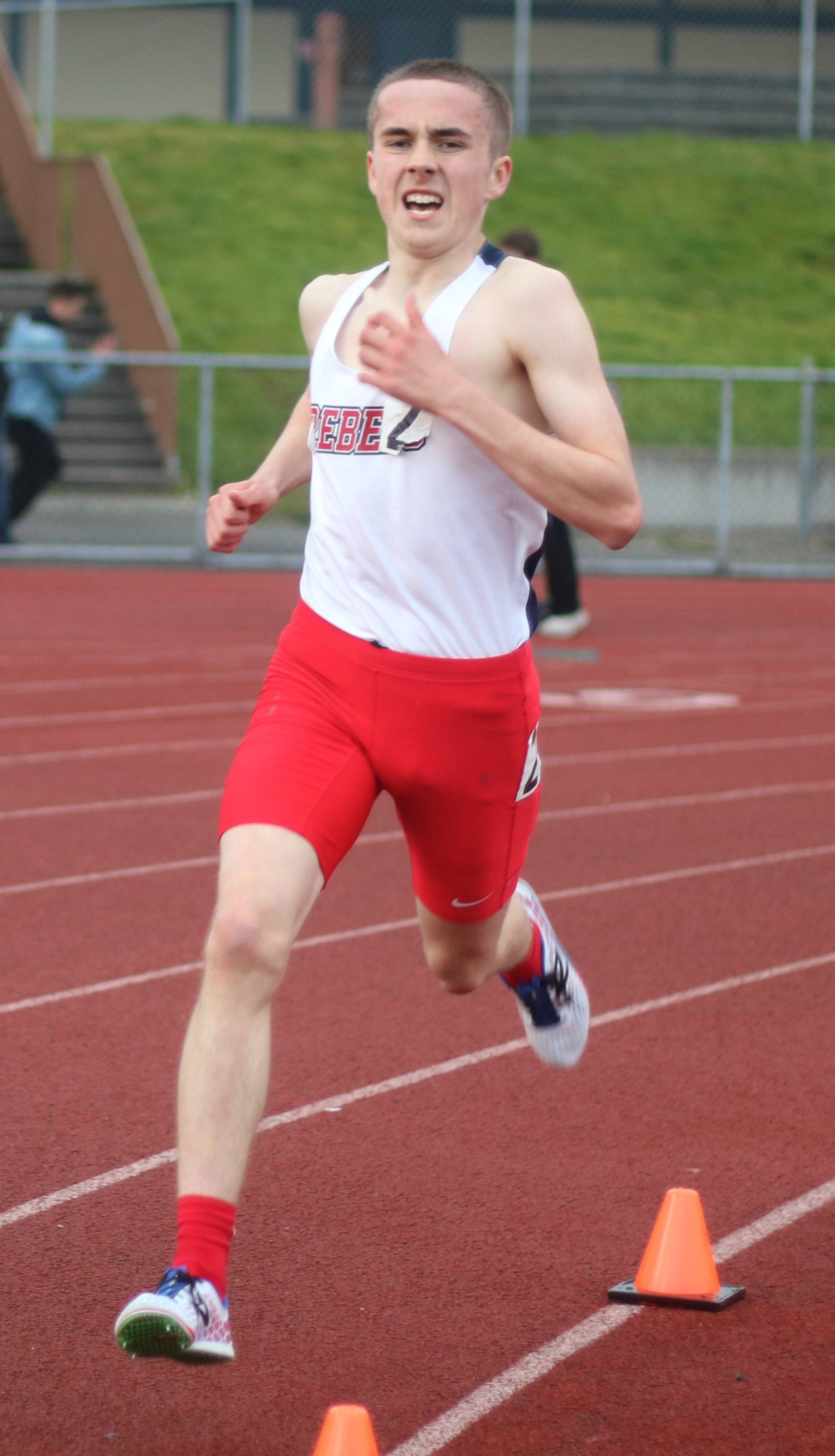 Juanita’s Adrian Goodwin rolls through the 3,200-meter run on April 13. He won the race in 9:38.62. Andy Nystrom, Reporter Newspapers