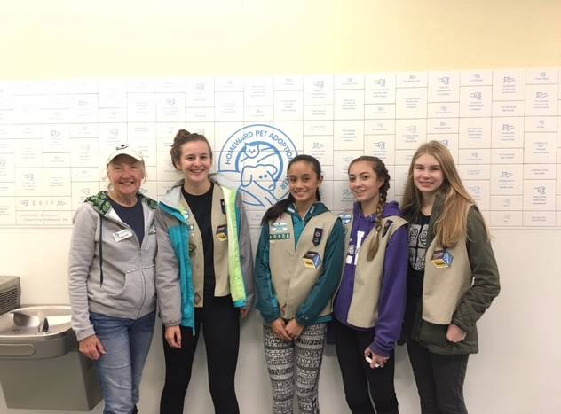 Peggy Noll from Homeward Pet Adoption Center poses for a photo with Troop 40908 Girl Scouts Grace Gordon, Ffion Mabale, Sarah Vincent and Karissa Fahsholtz. Courtesy photo