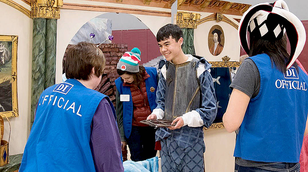 Impending Loom team member Adam Chen, who is a junior at Juanita High School, talks with Destination Imagination officials during a competition. Courtesy photo